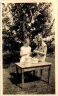 Ruth & Nancy peeling potatoes in the garden at Hedge End, 1928